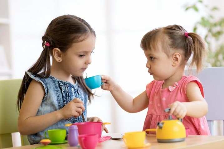 two girls pretending play