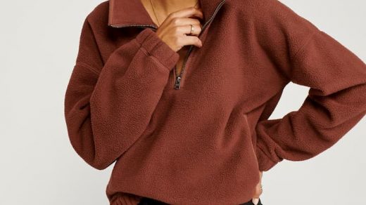 girl wearing polar brown fleece and leather pants