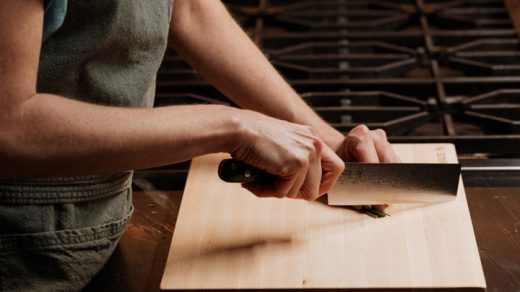 woman using nakiri knife