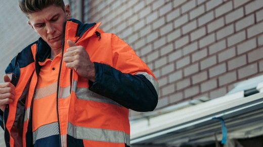 man wears work jacket